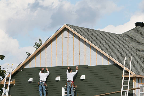 Professional Siding Installation technician working in Ault, CO